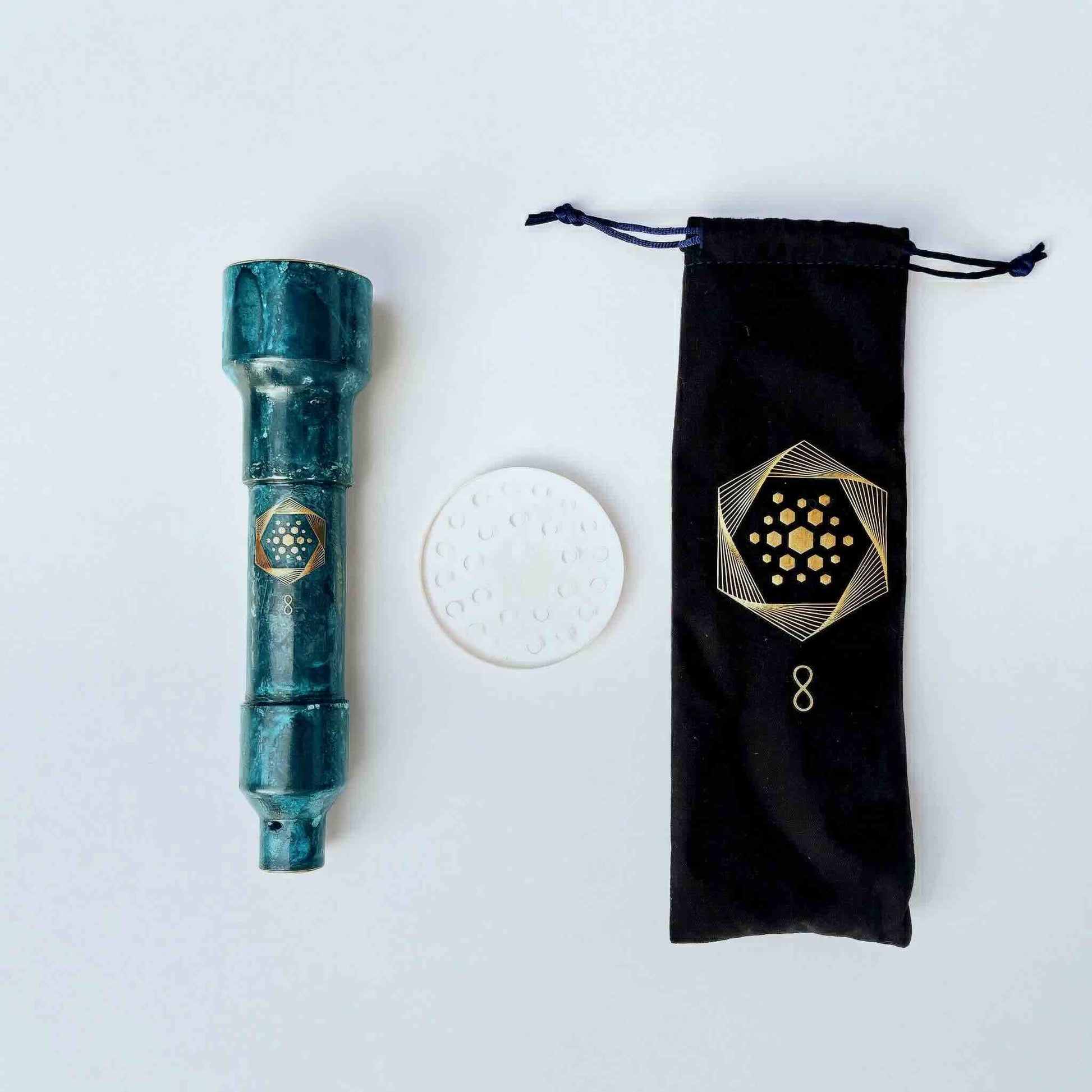 The Aqua Energizer On-the-Go Structured Water Device by Aqua Energizer, a green cylinder, is shown with a round white disc and black pouch with gold geometric design—ideal for enhanced natural energy and cellular hydration.