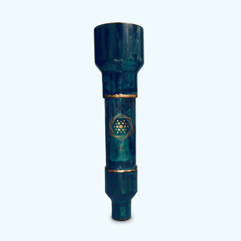 A cylindrical, dark green bamboo tube with a gold geometric design and the number 8 printed on it, standing upright against a light background.
