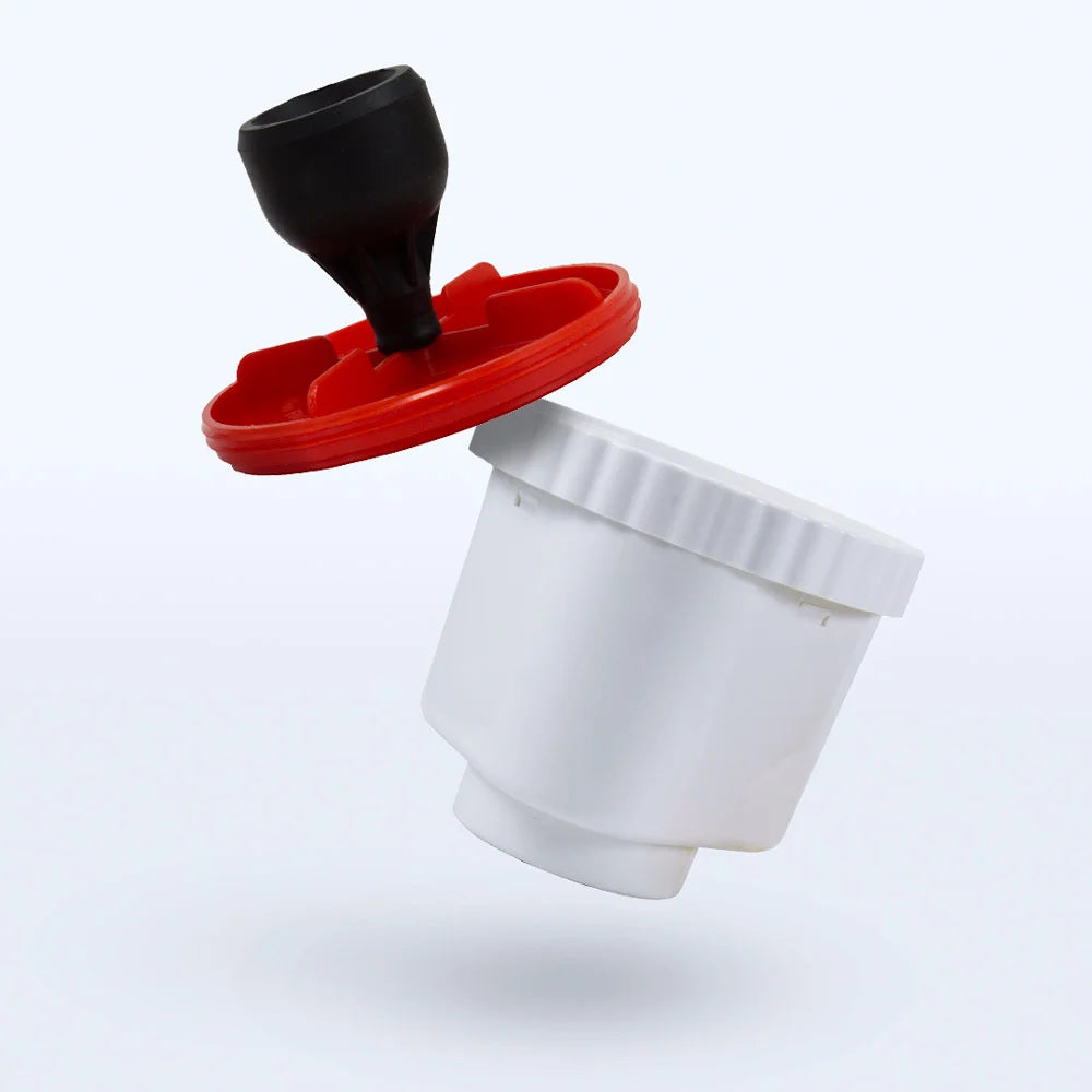 The Best Water Pitcher Ever Filter Replacement by Best Water Pitcher Ever is a white plastic container with a red lid and black nozzle, shown separated on a light background, designed for effective fluoride removal.