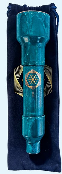 Aqua Energizer On-the-Go lying on its navy velvet carrying pouch with gold sacred geometry print